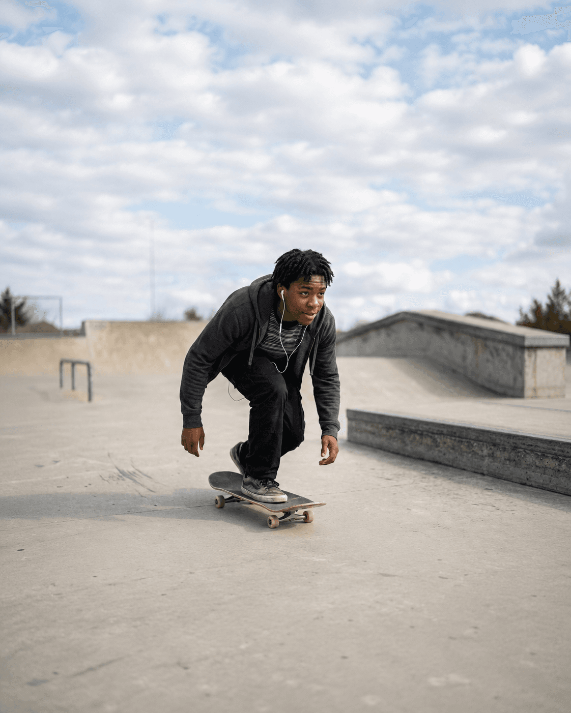 A person using Auracle while out on a skateboard